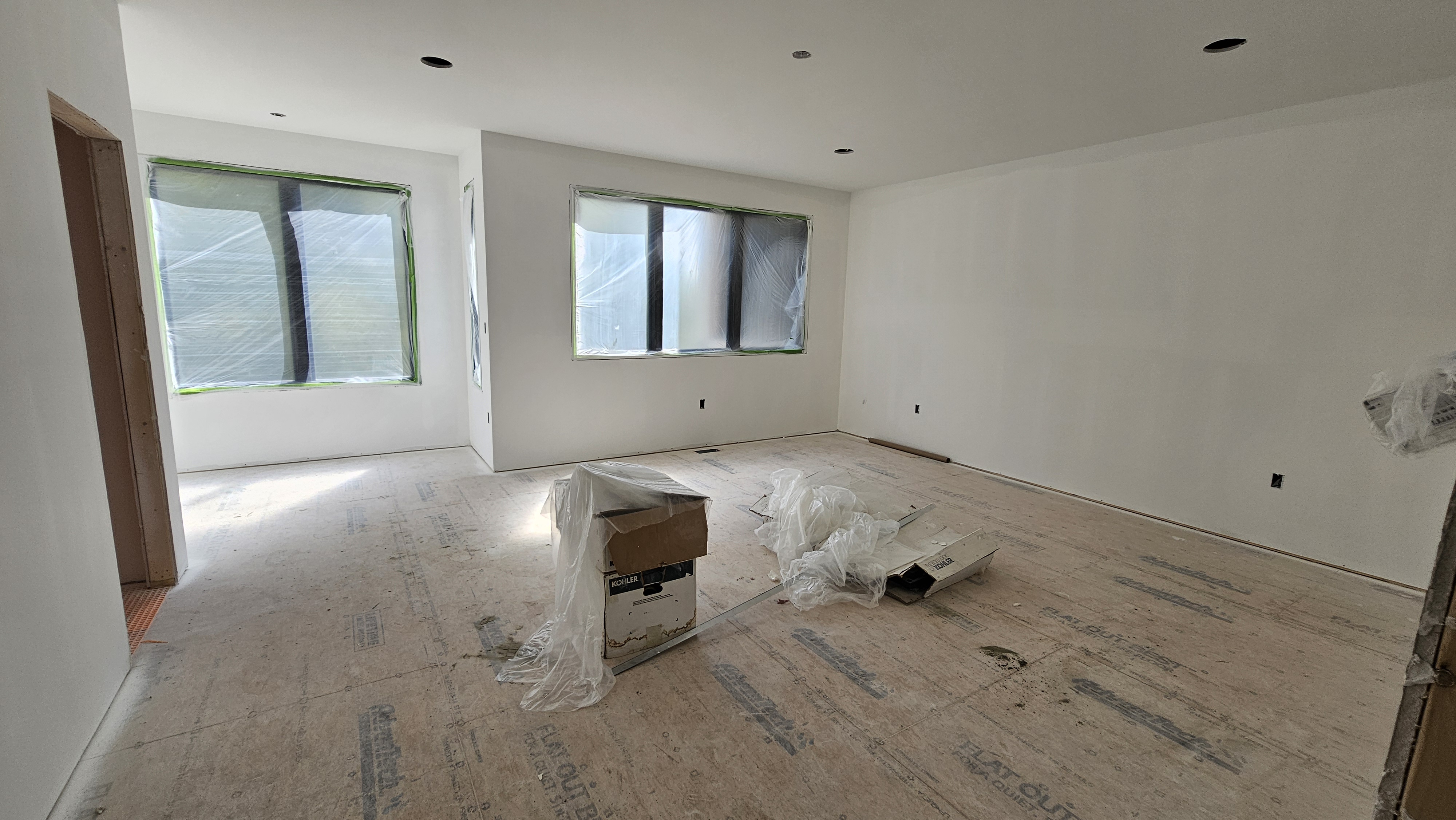 Frailey House great room with drywall and expansive windows